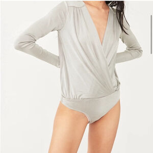 Free People Intimately Turnt Surplice Body suit in Oxide. size medium.